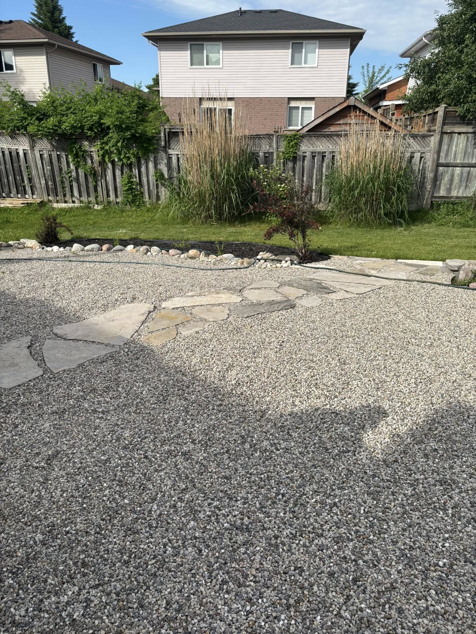 Three year comparison mulch versus stone landscape beds Sudbury property