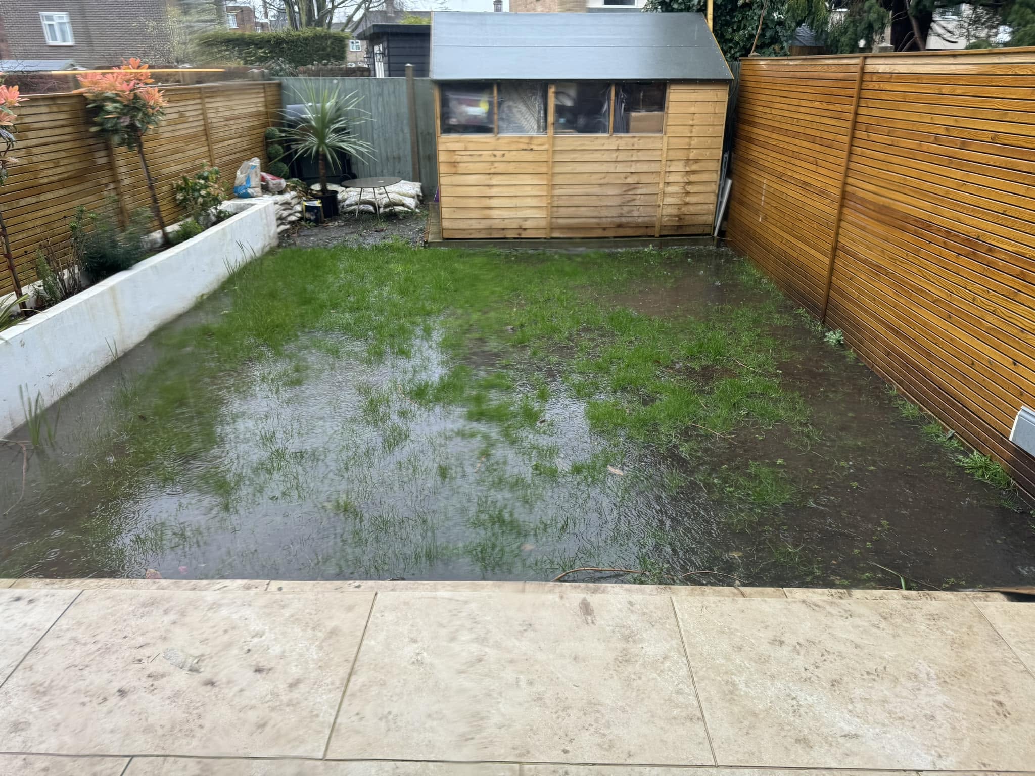 Unresolved drainage problem lawn Sudbury Ontario summer heat damage