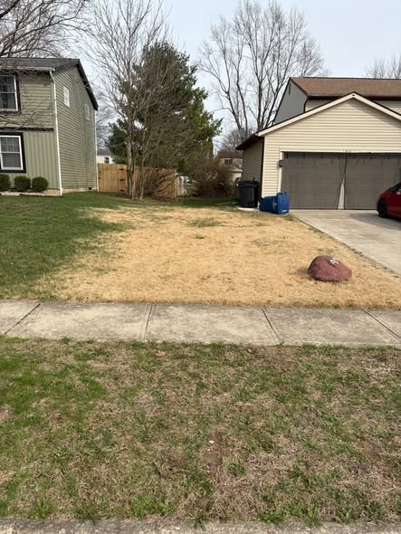 Val Caron Sudbury homeowner and Ryan Lingenfelter assessing struggling lawn together
