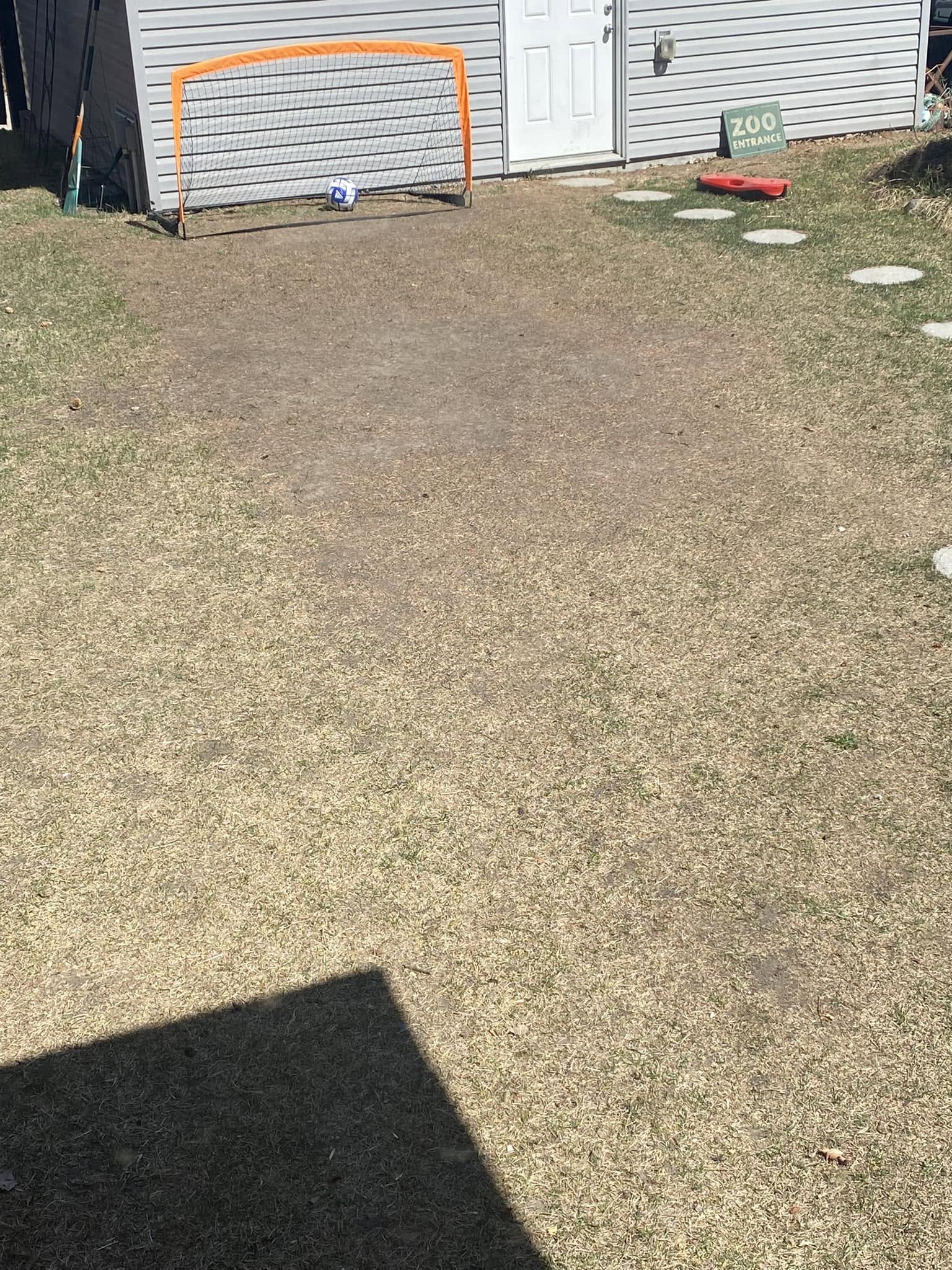 compacted soil hard residential lawn drainage issue Greater Sudbury Ontario struggling grass
