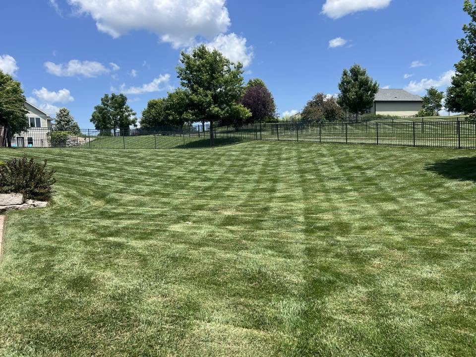 correct lawn mowing pattern straight lines residential yard Greater Sudbury Ontario technique