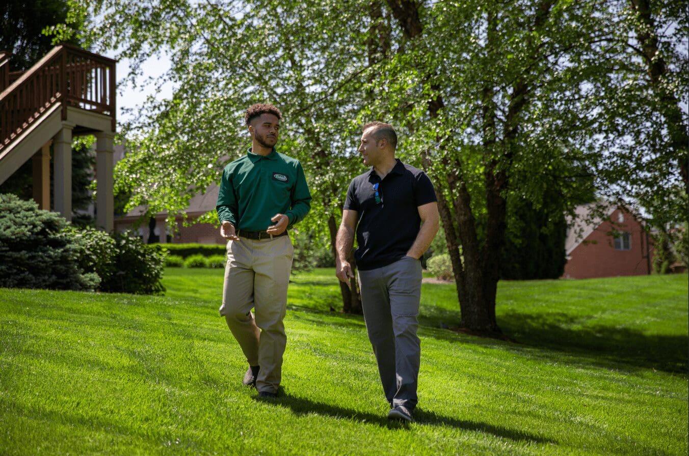 explaining lawn care findings to Sudbury customer