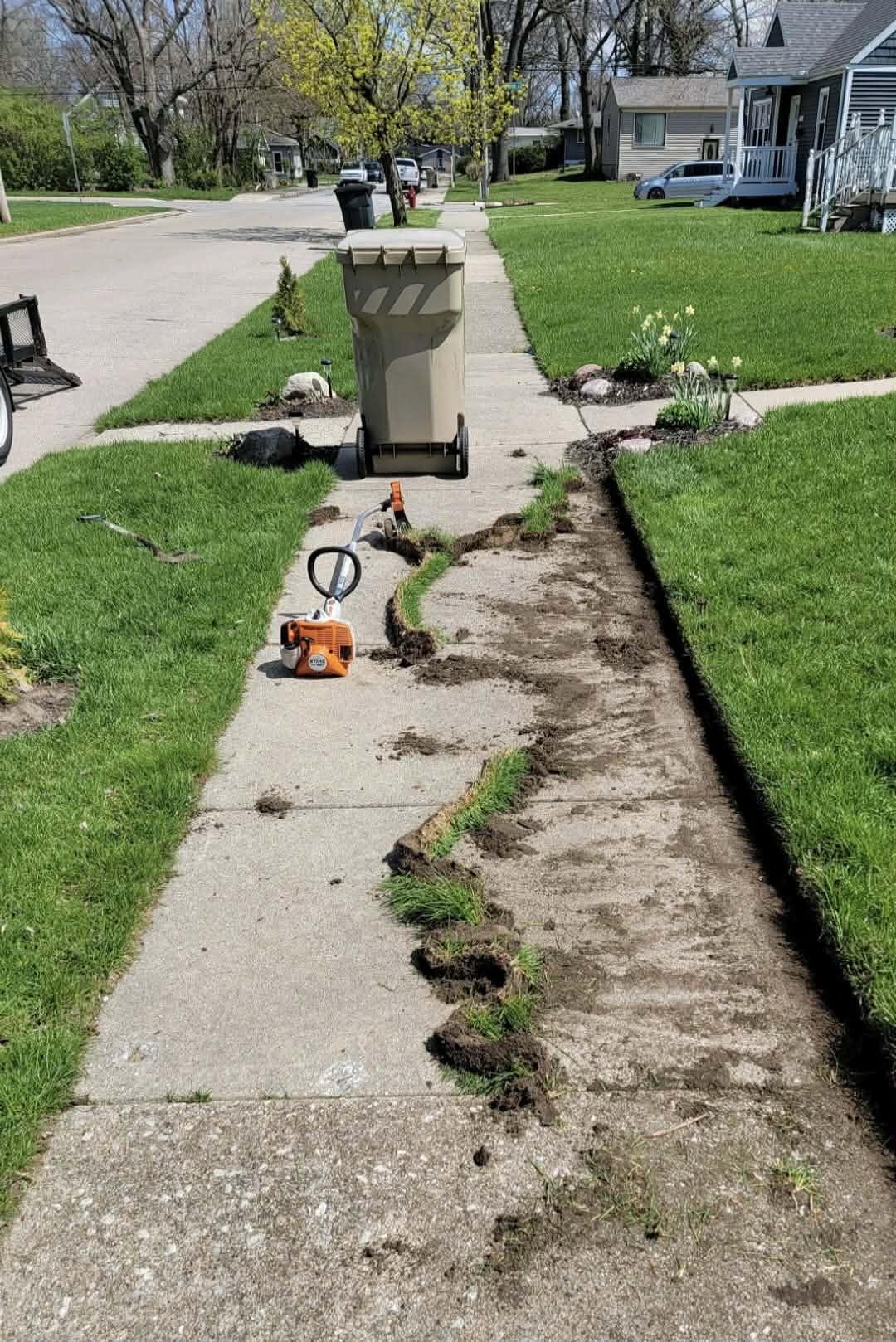 lawn edge quality driveway border ragged versus sharp residential Sudbury Ontario maintenance indicator
