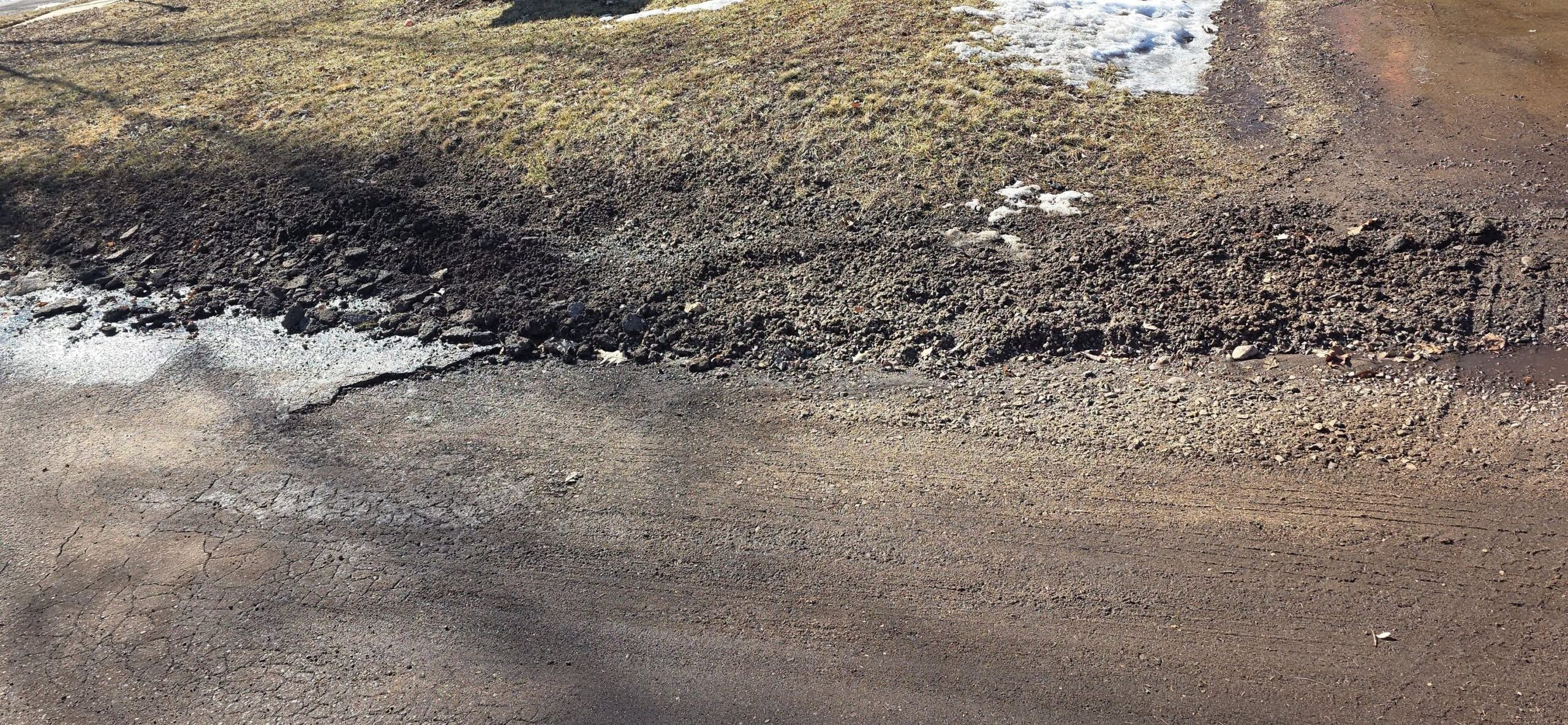 minor snowplow scrape edge damage residential driveway Greater Sudbury Ontario normal seasonal wear
