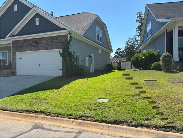 two residential properties same street Greater Sudbury Ontario identical soil sun conditions comparison
