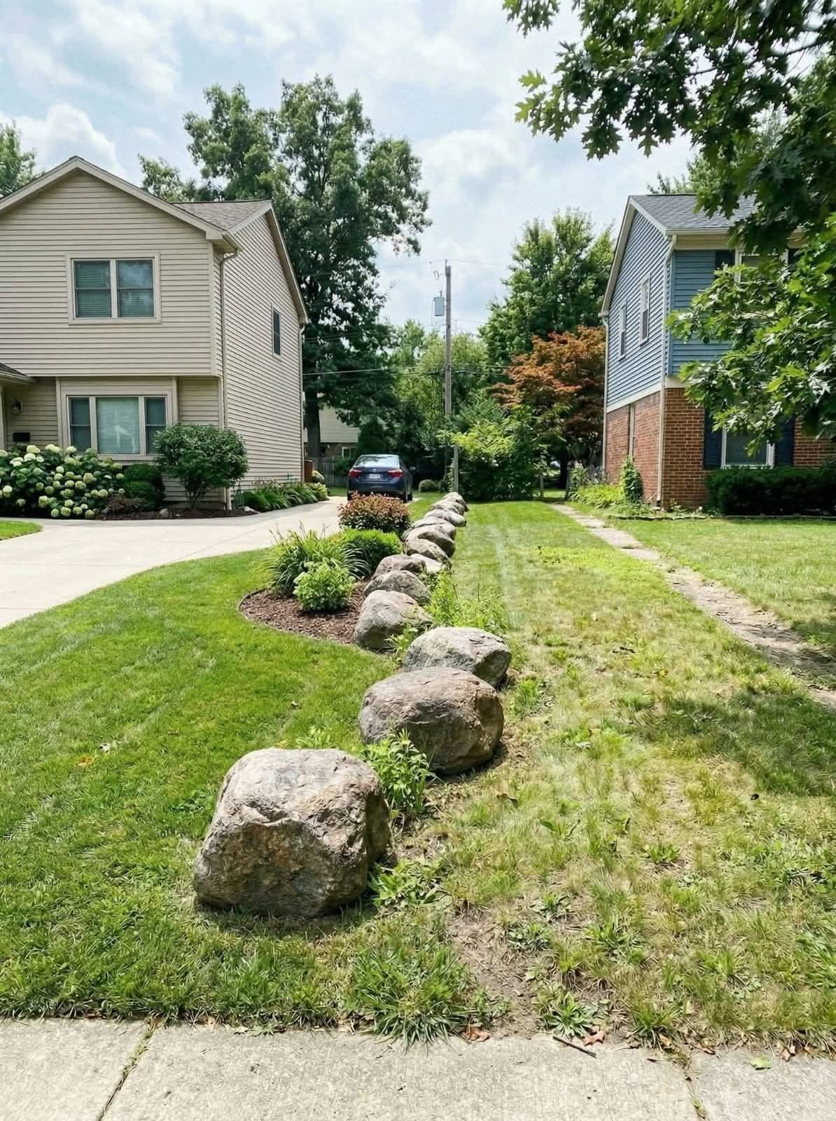 Corner lot lawn Greater Sudbury Ontario extra exposure traffic edge challenges
