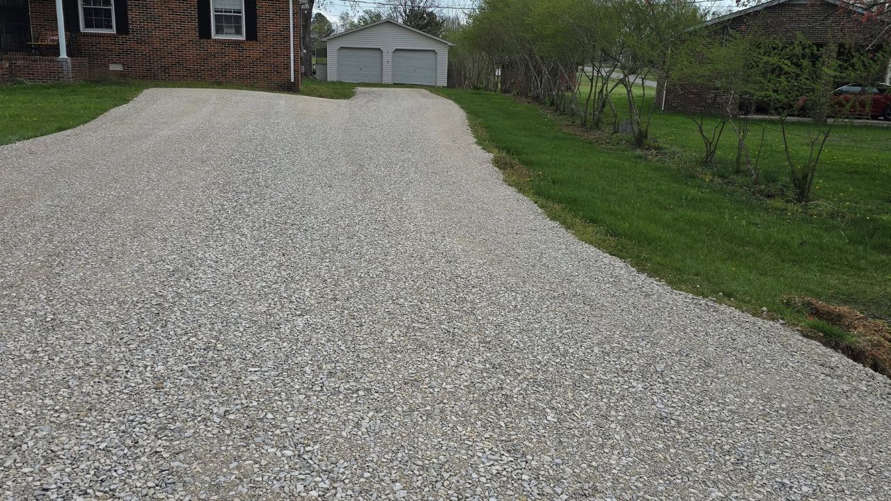 Gravel driveway and interlock driveway side by side on Sudbury Ontario residential properties