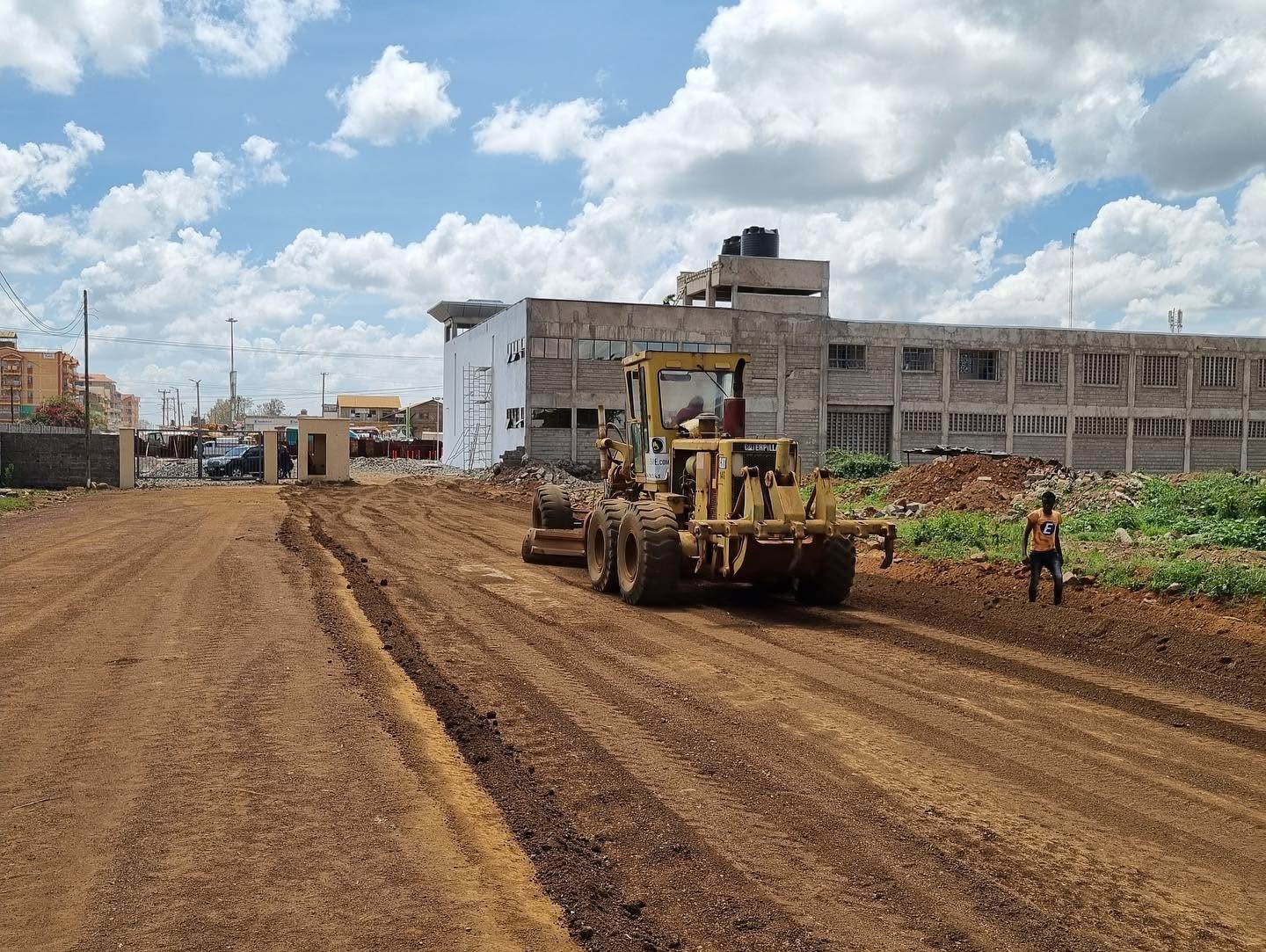 Heavy construction equipment compacting soil on new Sudbury subdivision development
