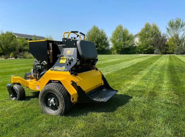Lawn aeration being done before overseeding on Sudbury property