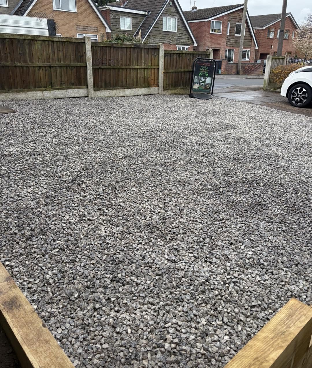Maintained gravel driveway on Sudbury property in good condition