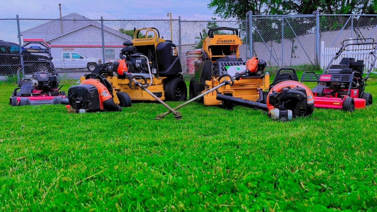 Professional grass cutting service on a residential lawn in Greater Sudbury Ontario