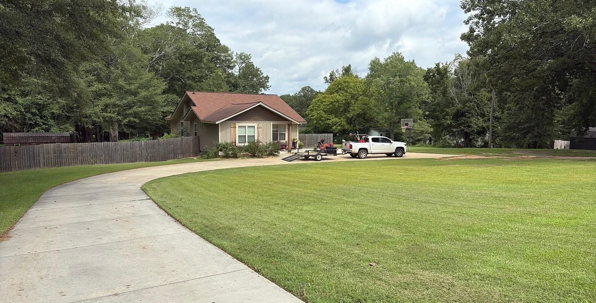 Ryan Lingenfelter adjusting lawn care approach on Sudbury property based on 2026 conditions