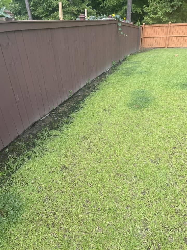 Wet saturated lawn strip in Sudbury caused by neighbour downspout runoff