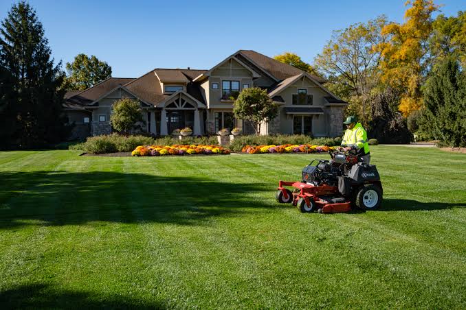 reviewing customer notes after a Sudbury lawn care check in call