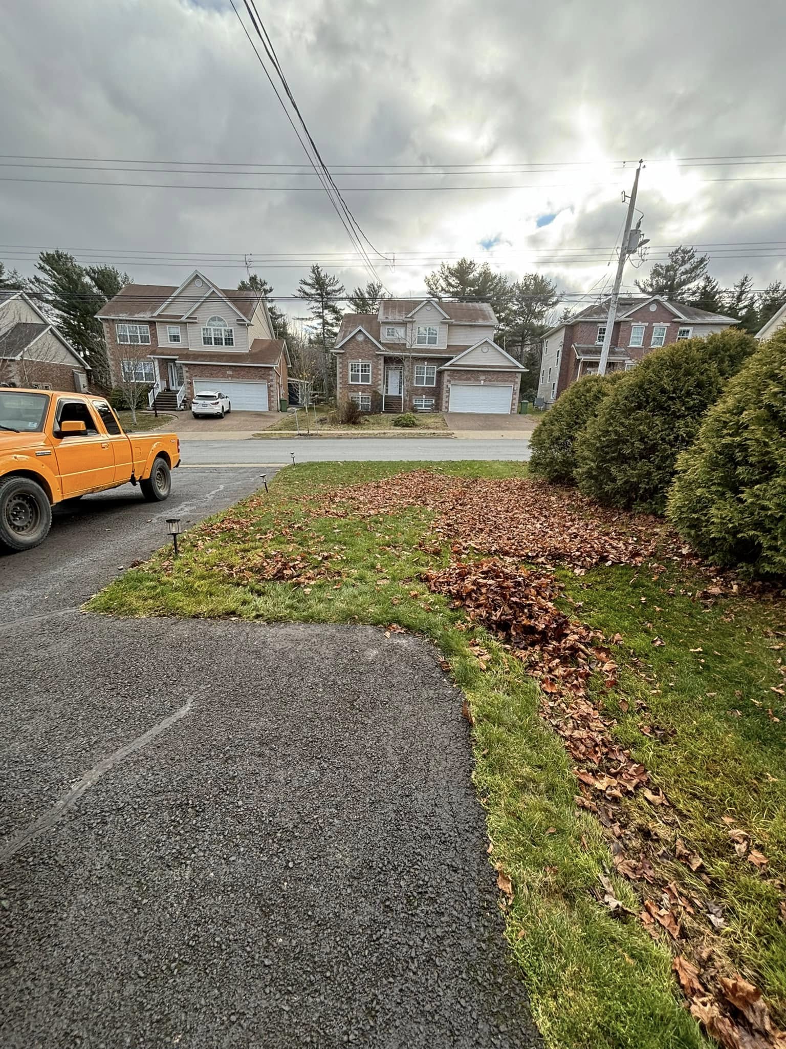 overlooked debris and leaf buildup left behind after an incomplete property cleanup